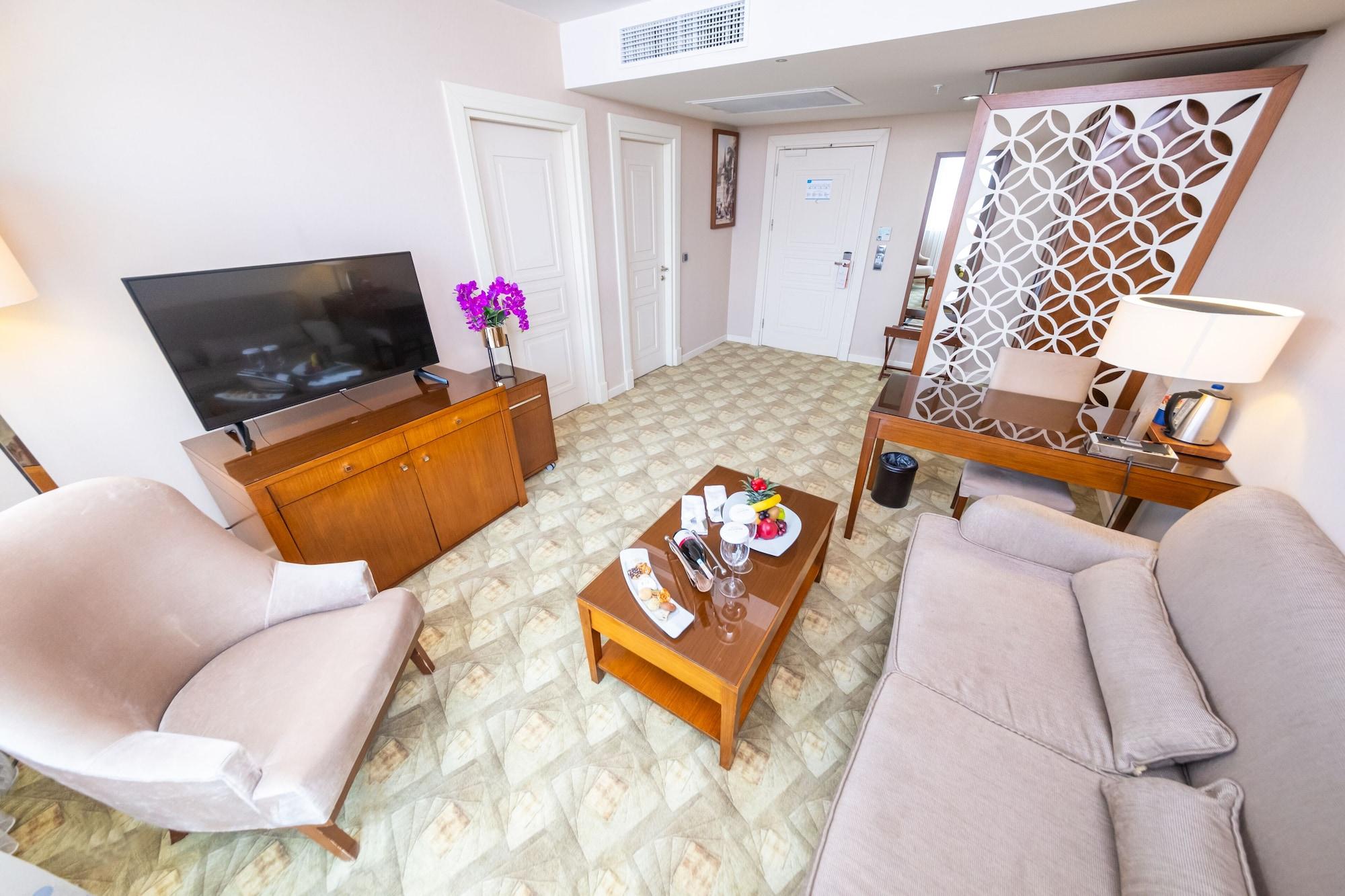 Miracle Istanbul Asia Airport Hotel & Spa Экстерьер фото A living room in a suite at the hotel